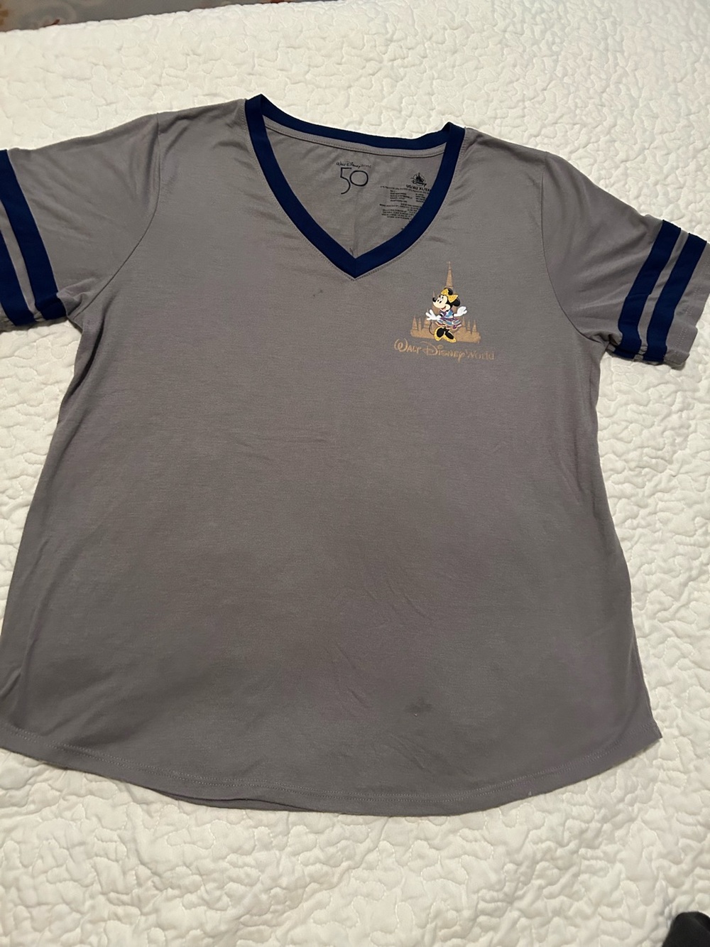Disney 50 th anniversary Minnie Mouse gray Tee with Navy Trim Character on back.